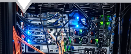 Cropped shot of the inside of a computer with all of its wiring located in a server room