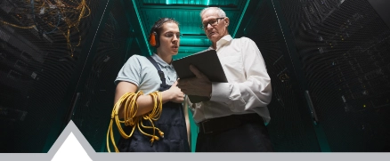 Two People in Server Room Low Angle